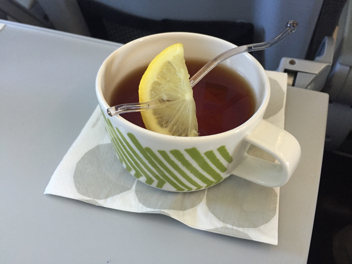 a cup of tea with a lemon slice in it