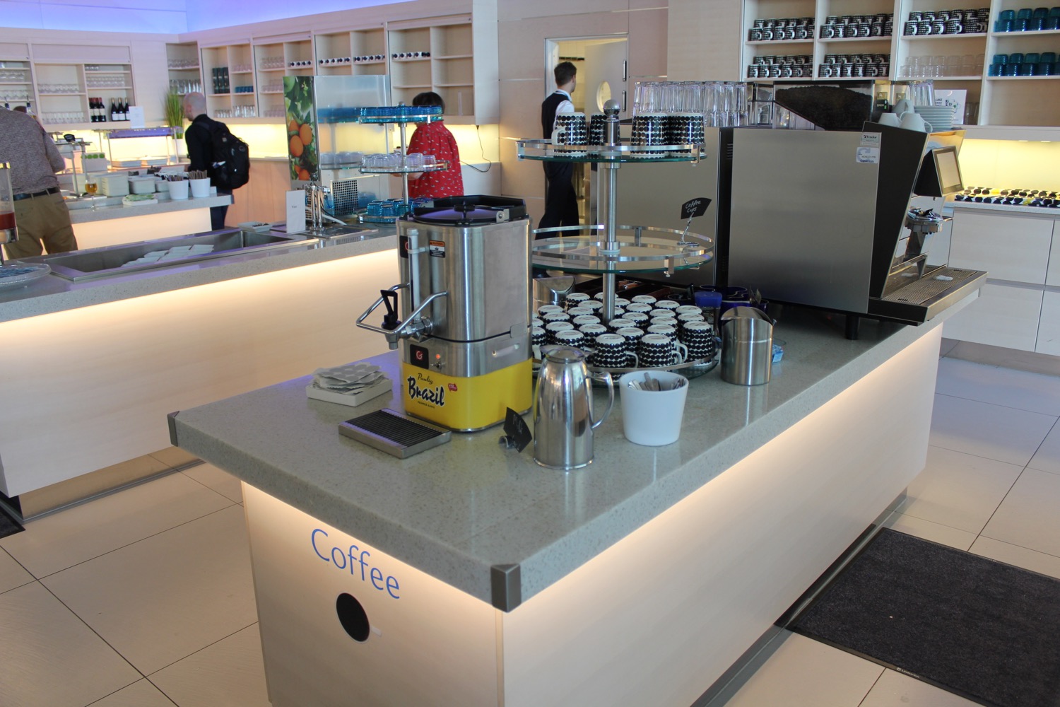 a counter with a machine and cups on it