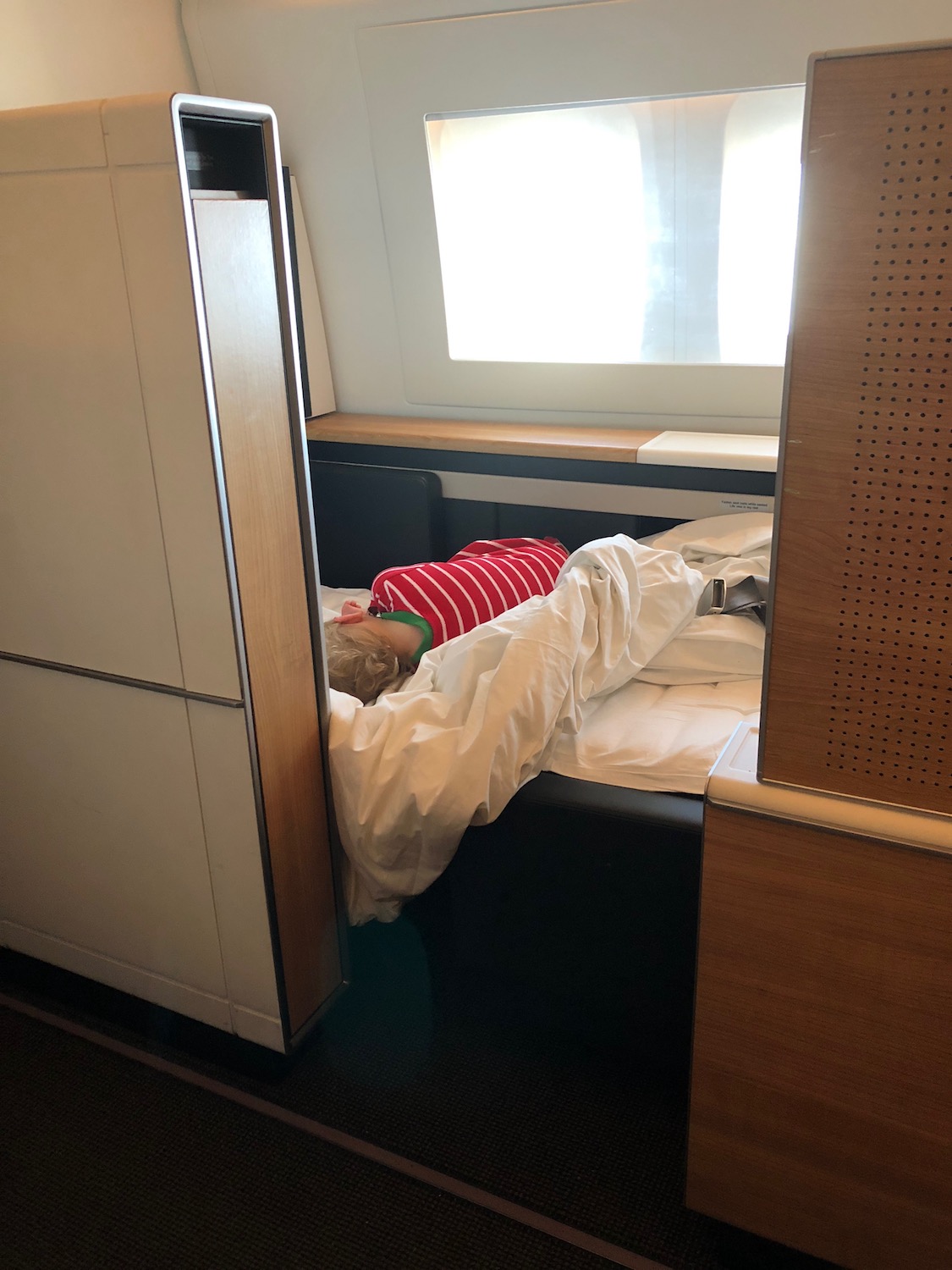 a child sleeping in a bed