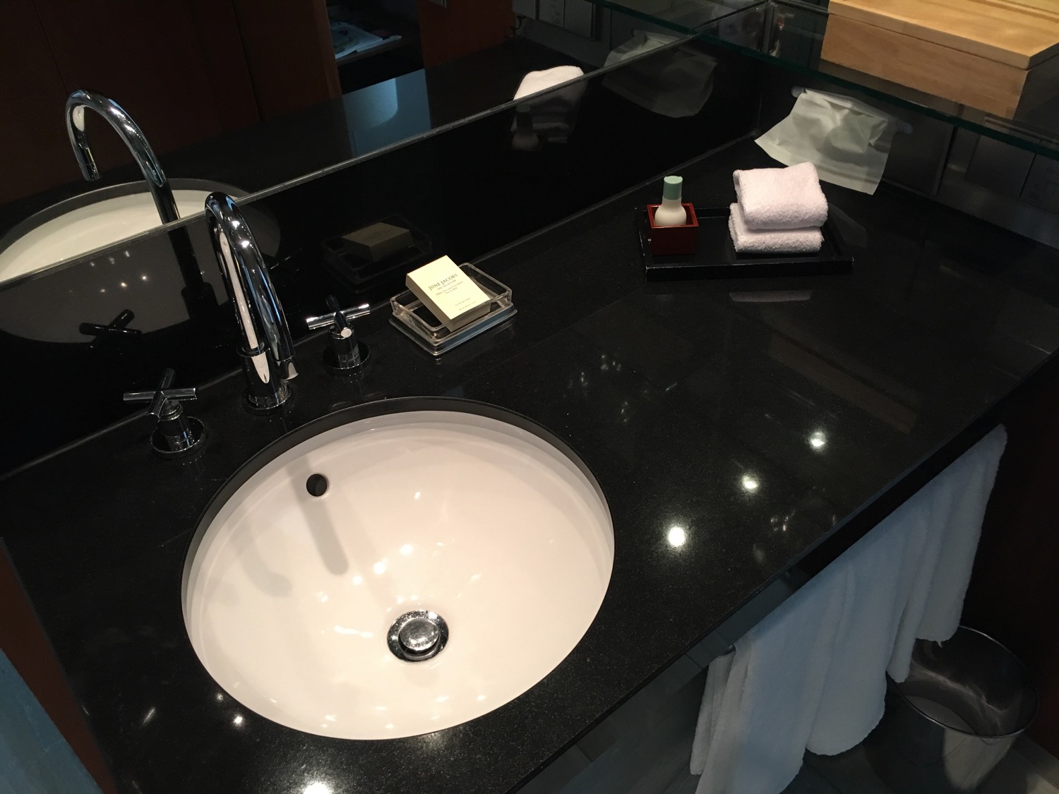 a sink with a black counter top