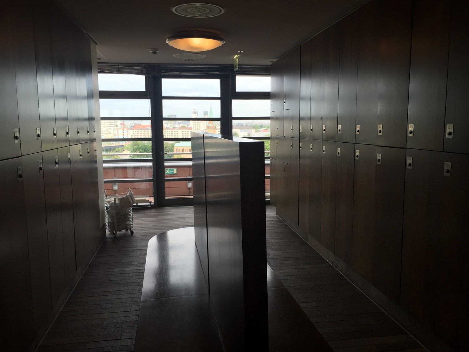 a hallway with lockers and a window