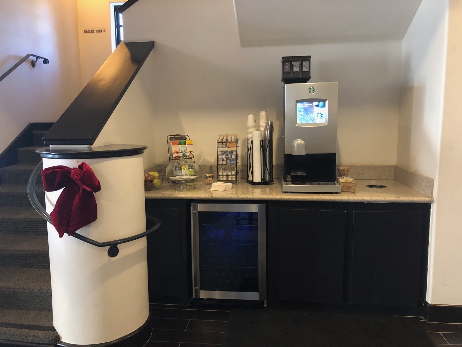 a coffee machine and a refrigerator in a room