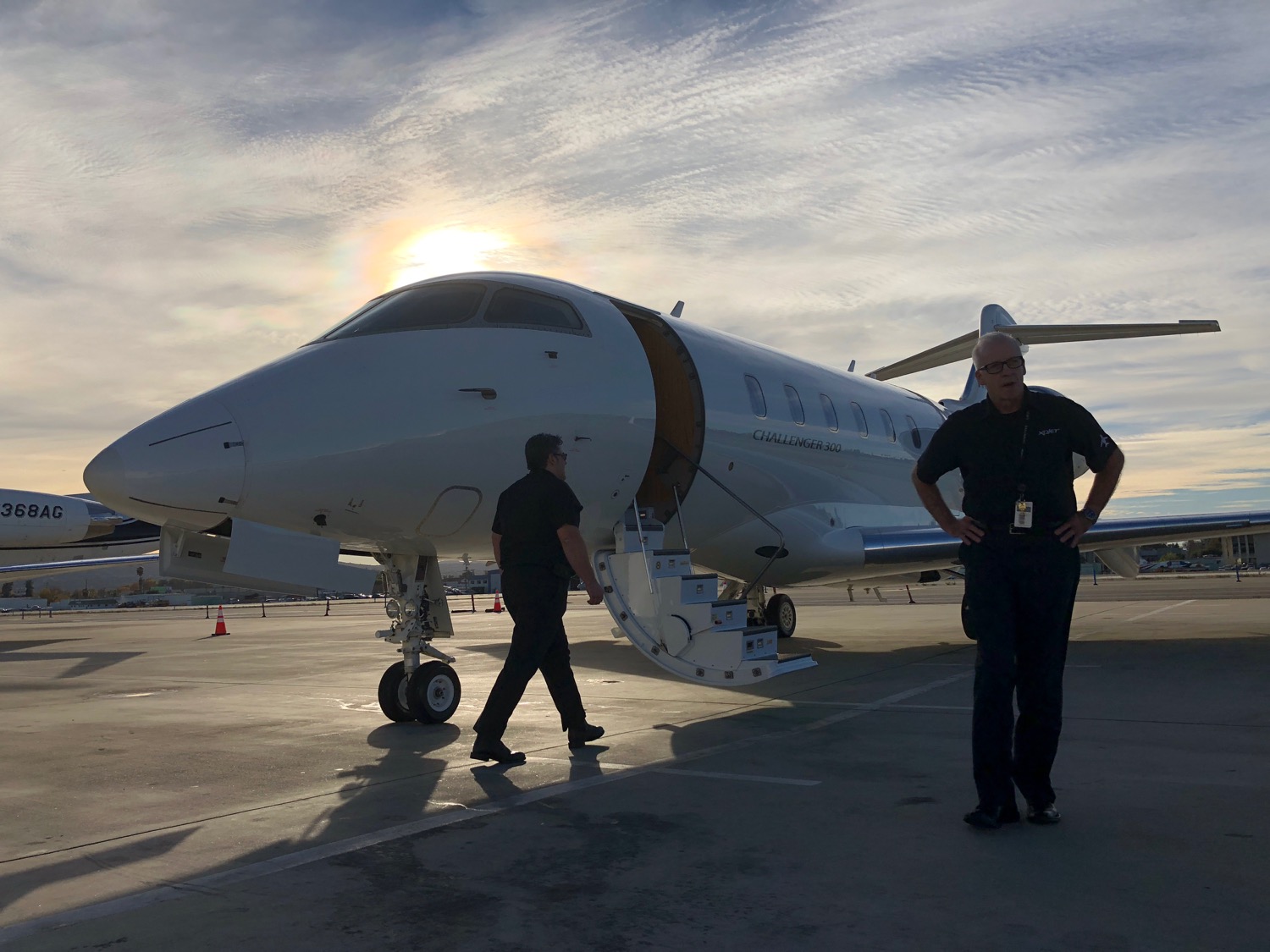 a man standing next to a plane
