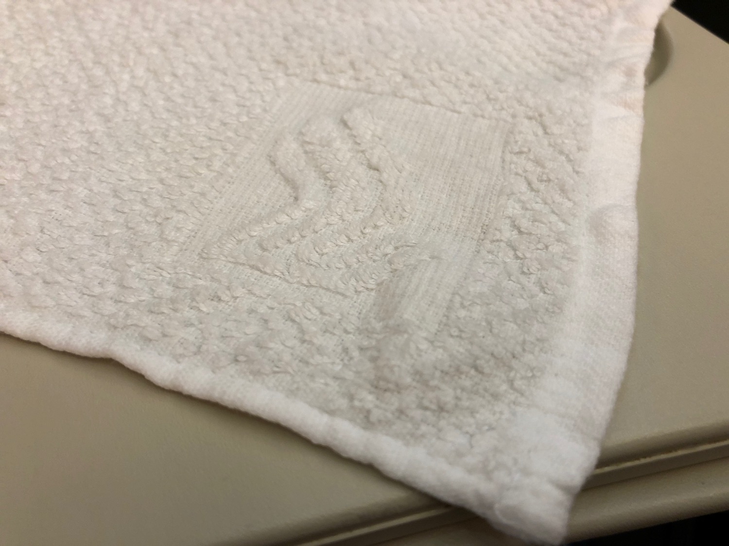 a white towel on a counter