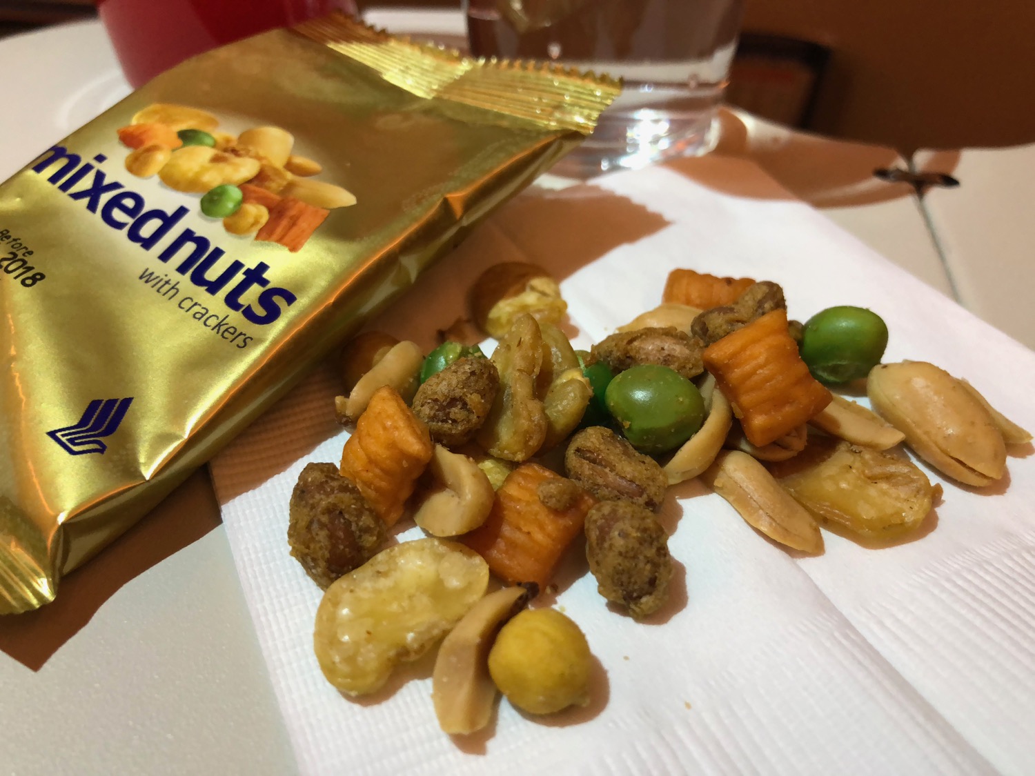 a pile of nuts and crackers on a napkin