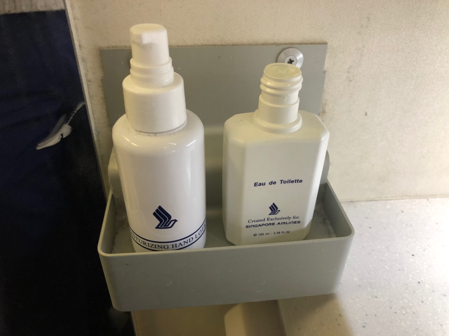 a couple of white bottles in a holder