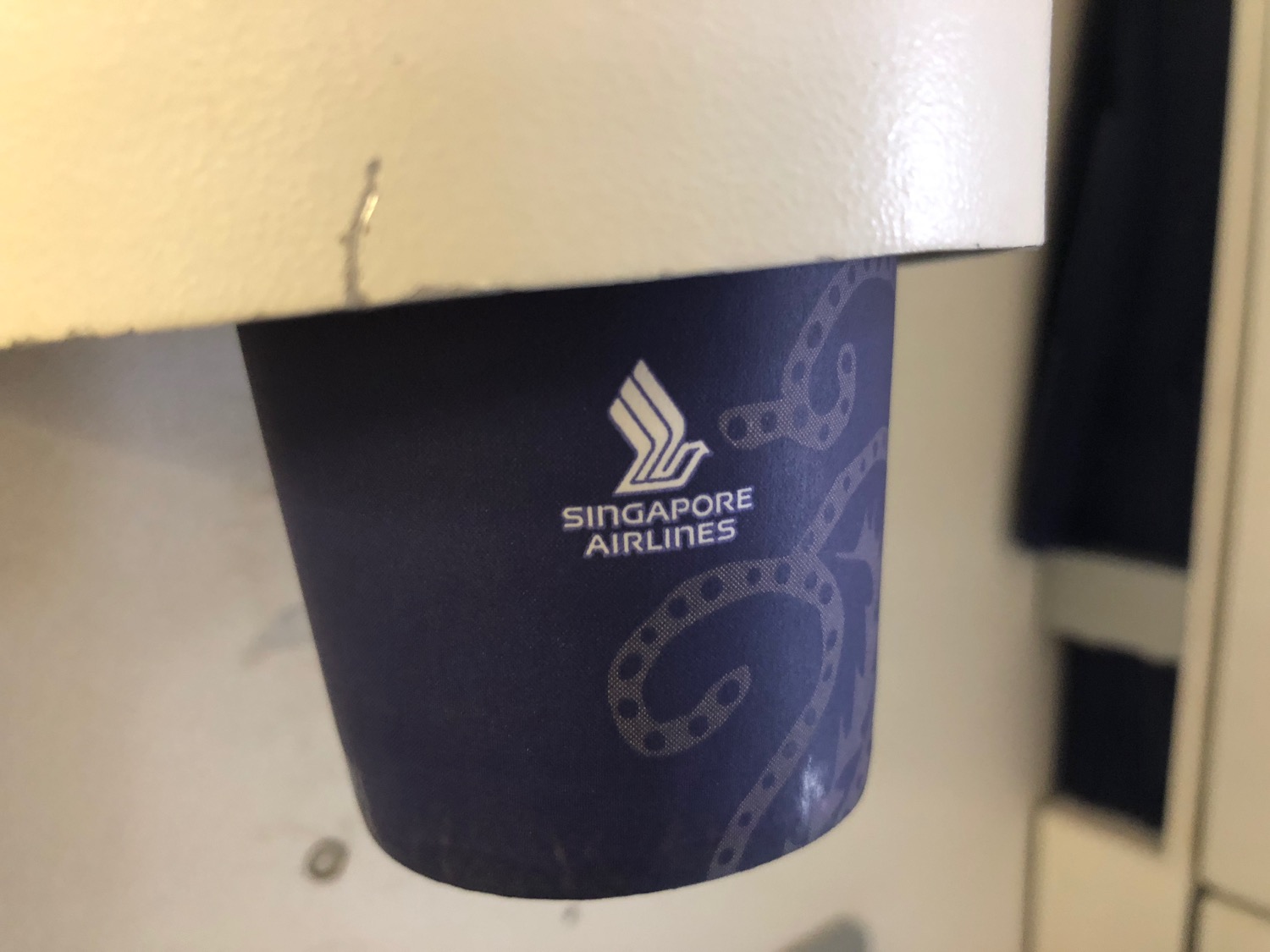 a blue cup with white text on it