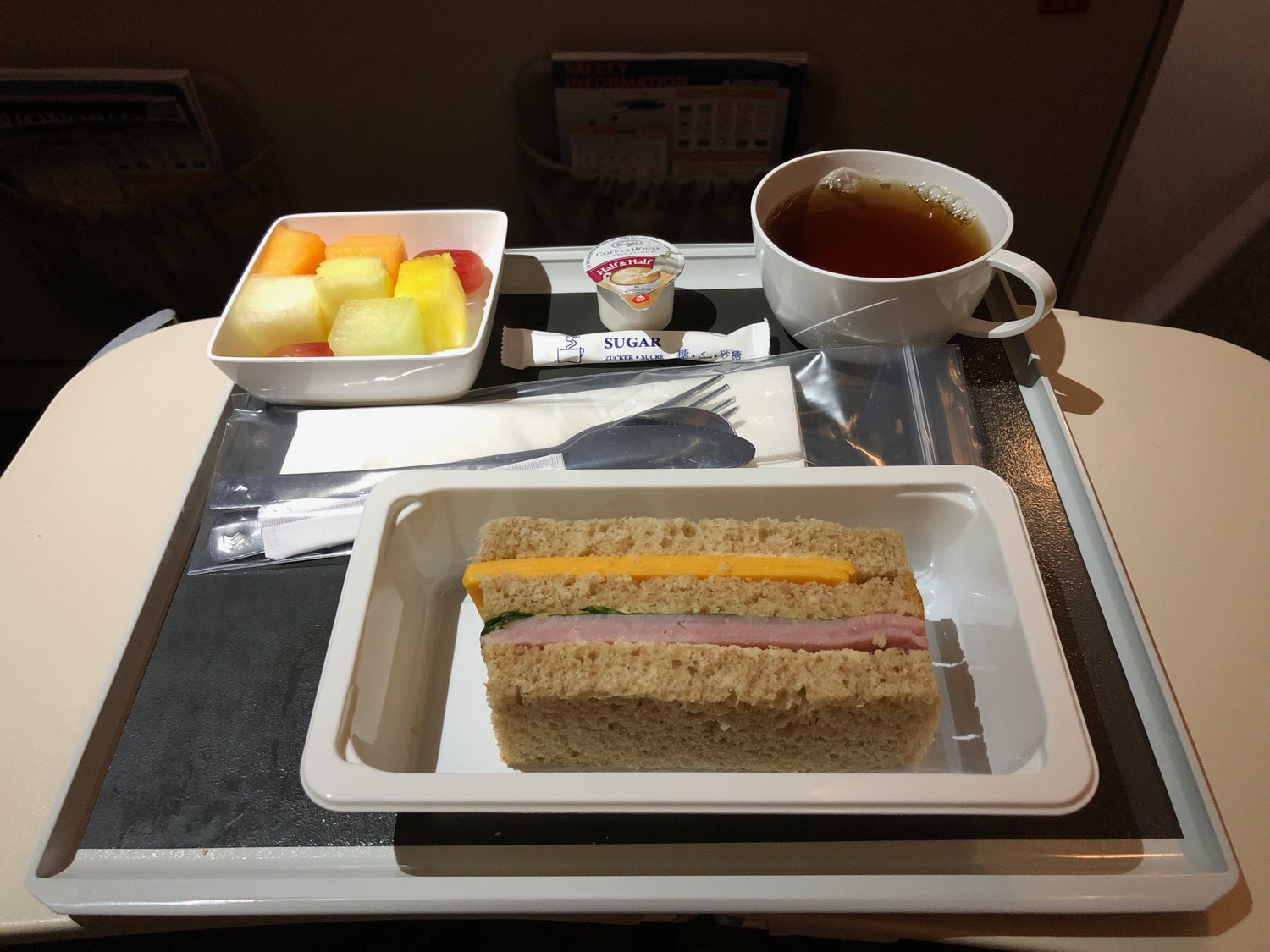 a tray with food and a cup of tea on it