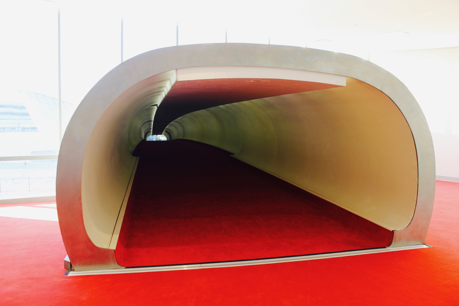a red carpet on a tunnel
