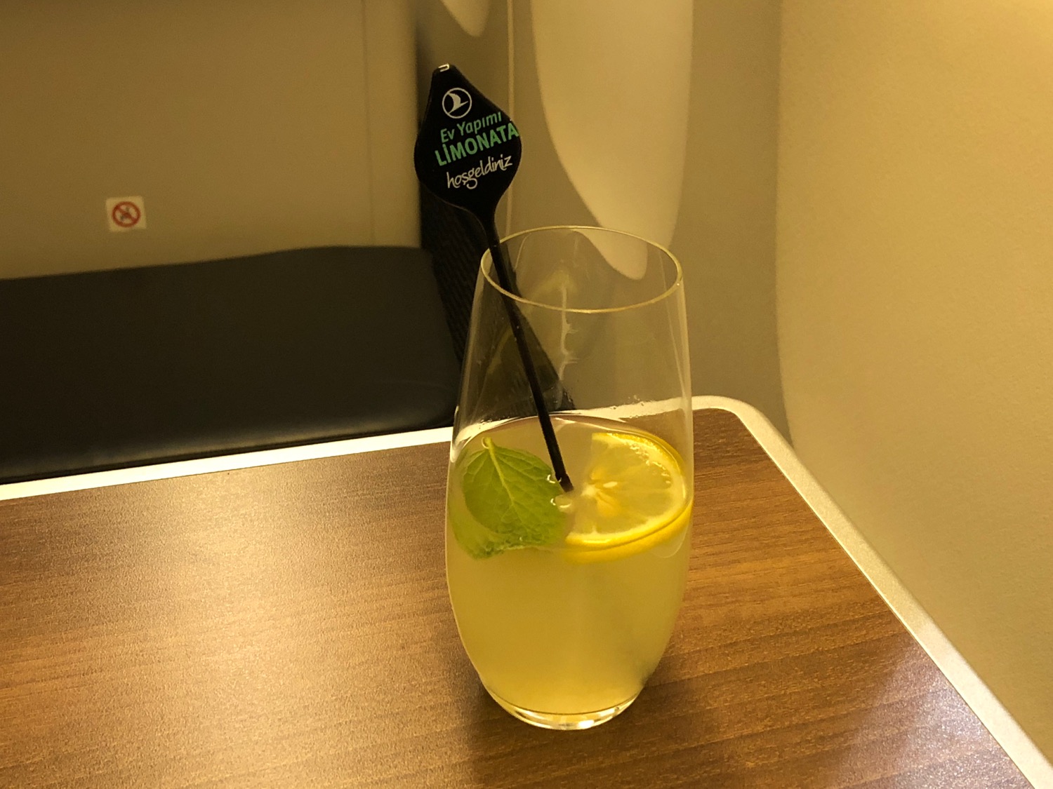 a glass of lemonade on a table