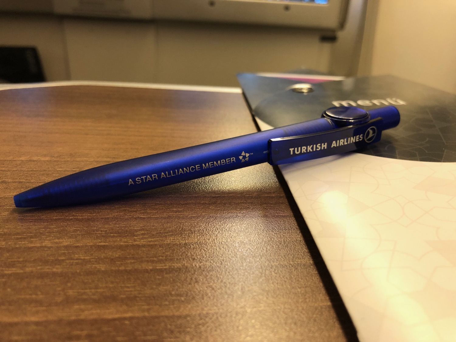 a blue pen on a table