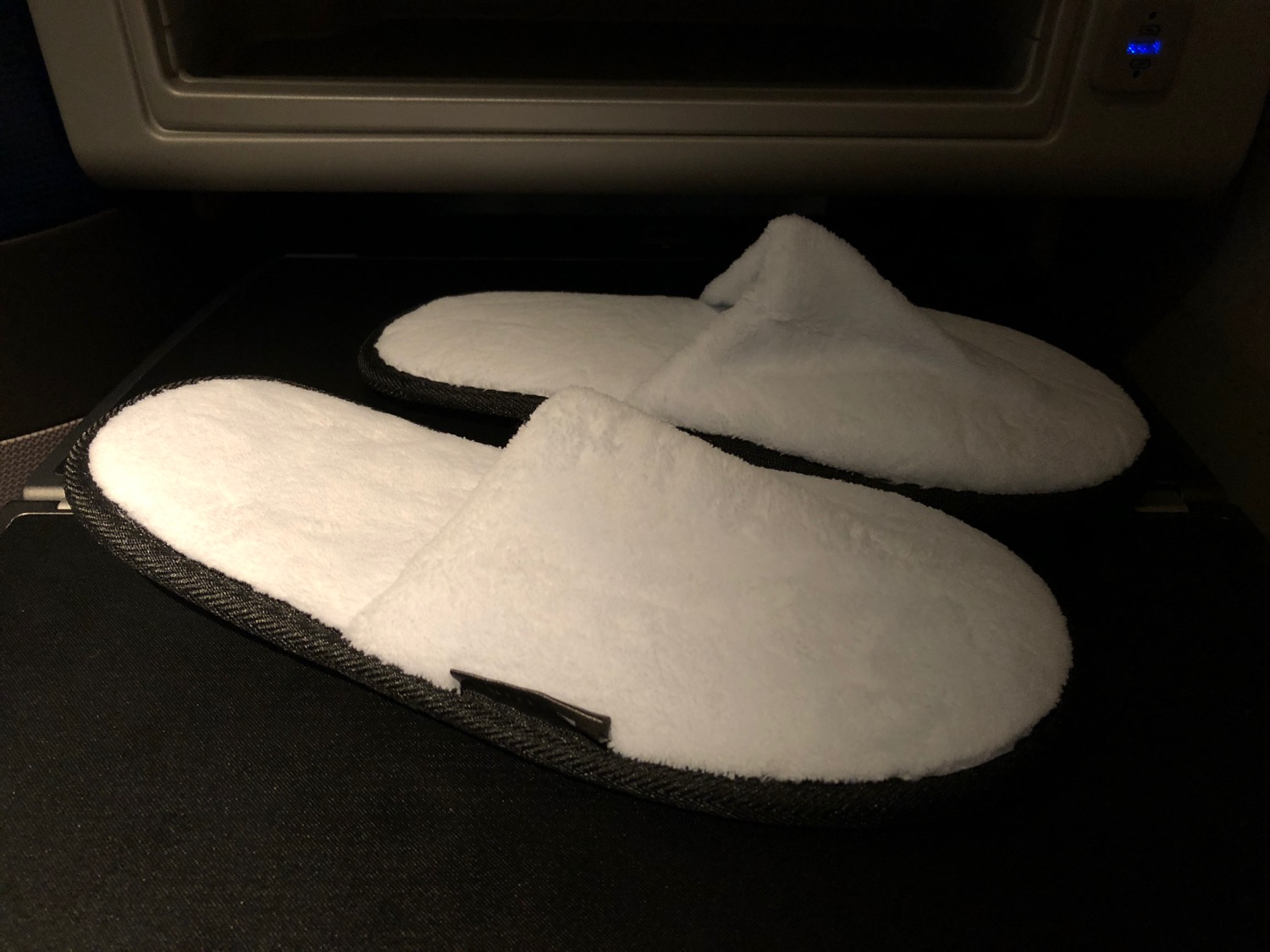 a pair of white slippers in a microwave