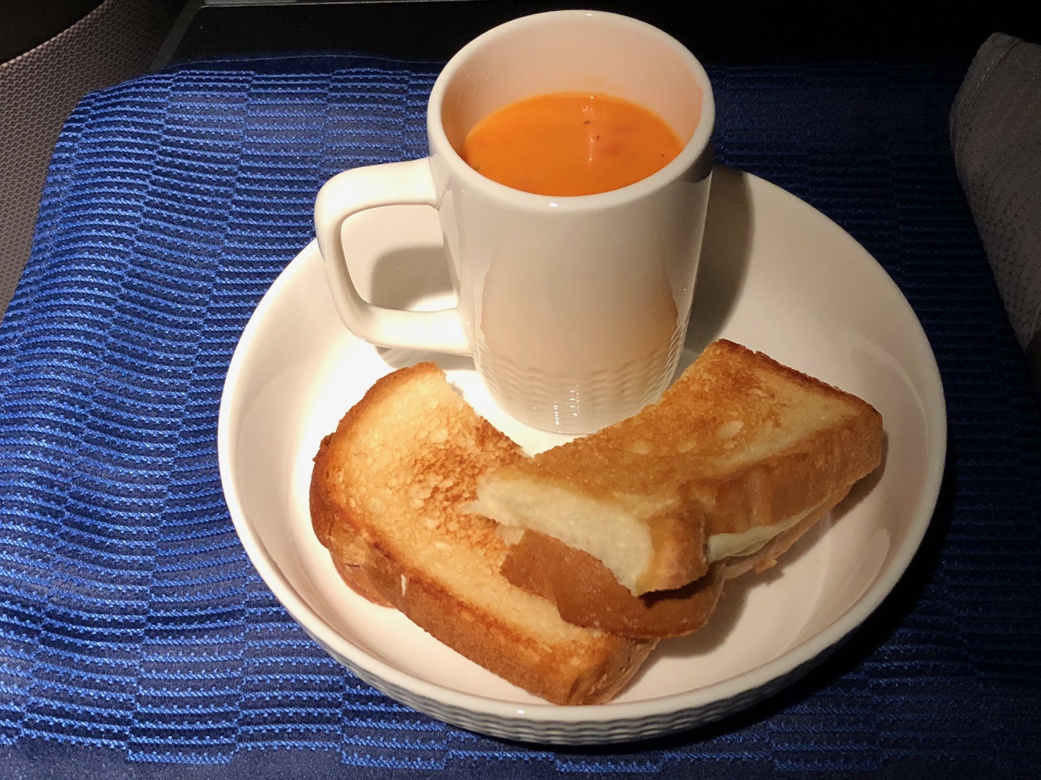 a plate of food and a cup of soup