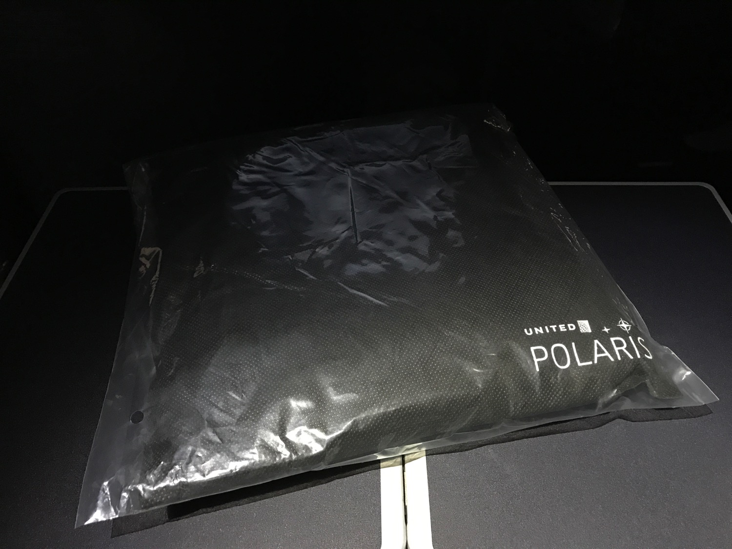 a black plastic bag on a black surface