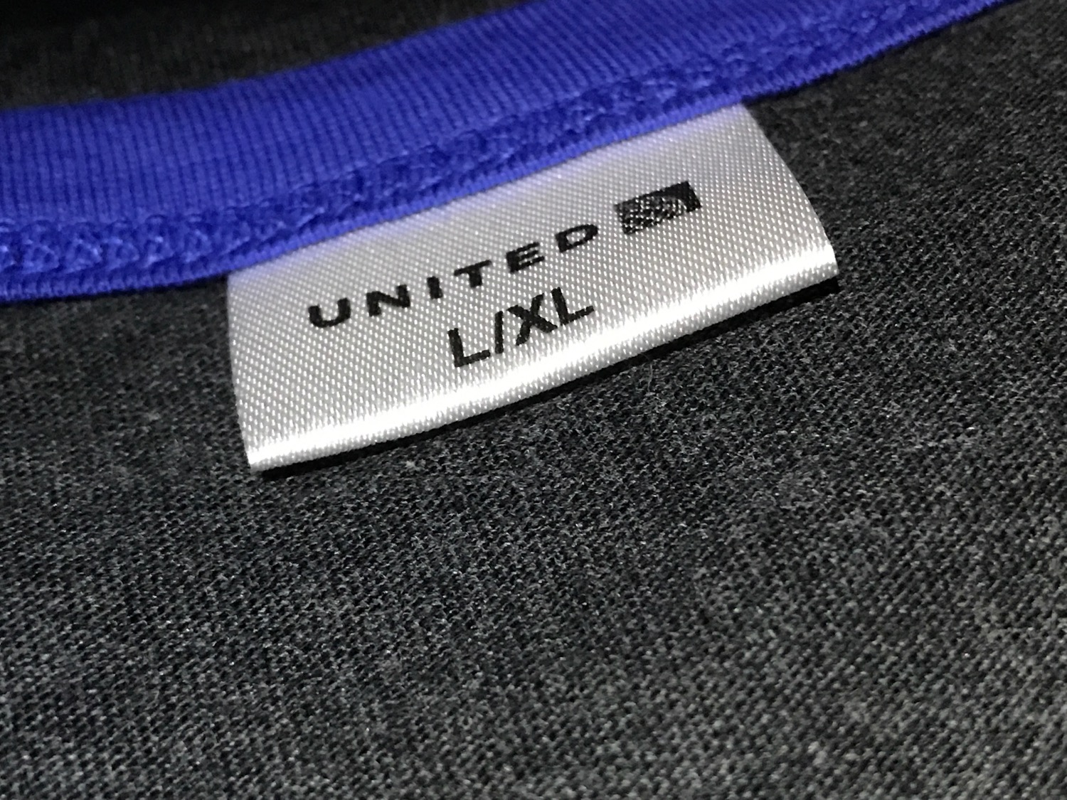 a white label on a blue fabric