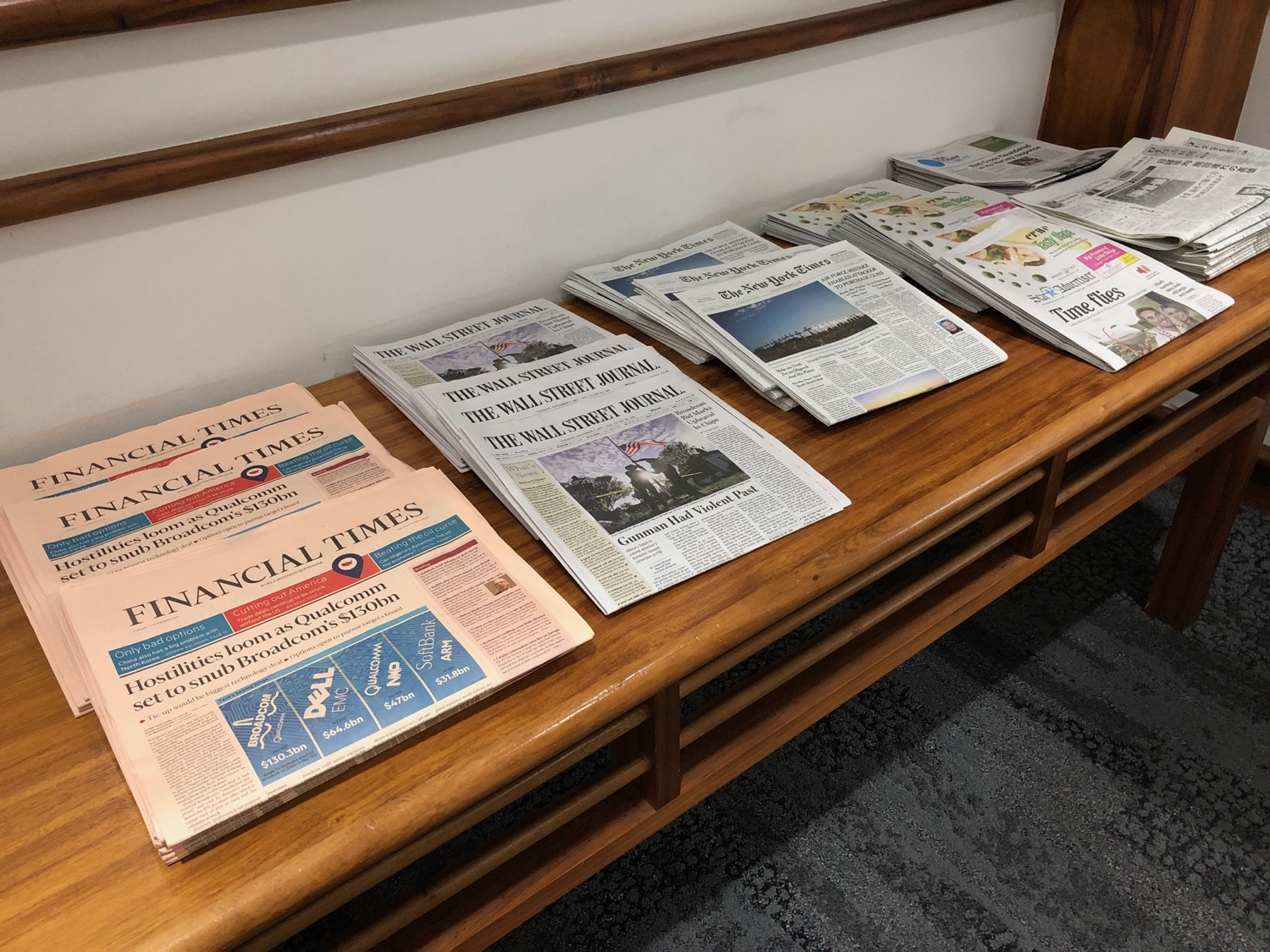 a group of newspapers on a bench