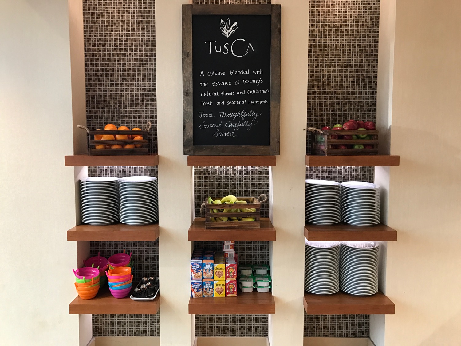 a shelf with food and a chalkboard