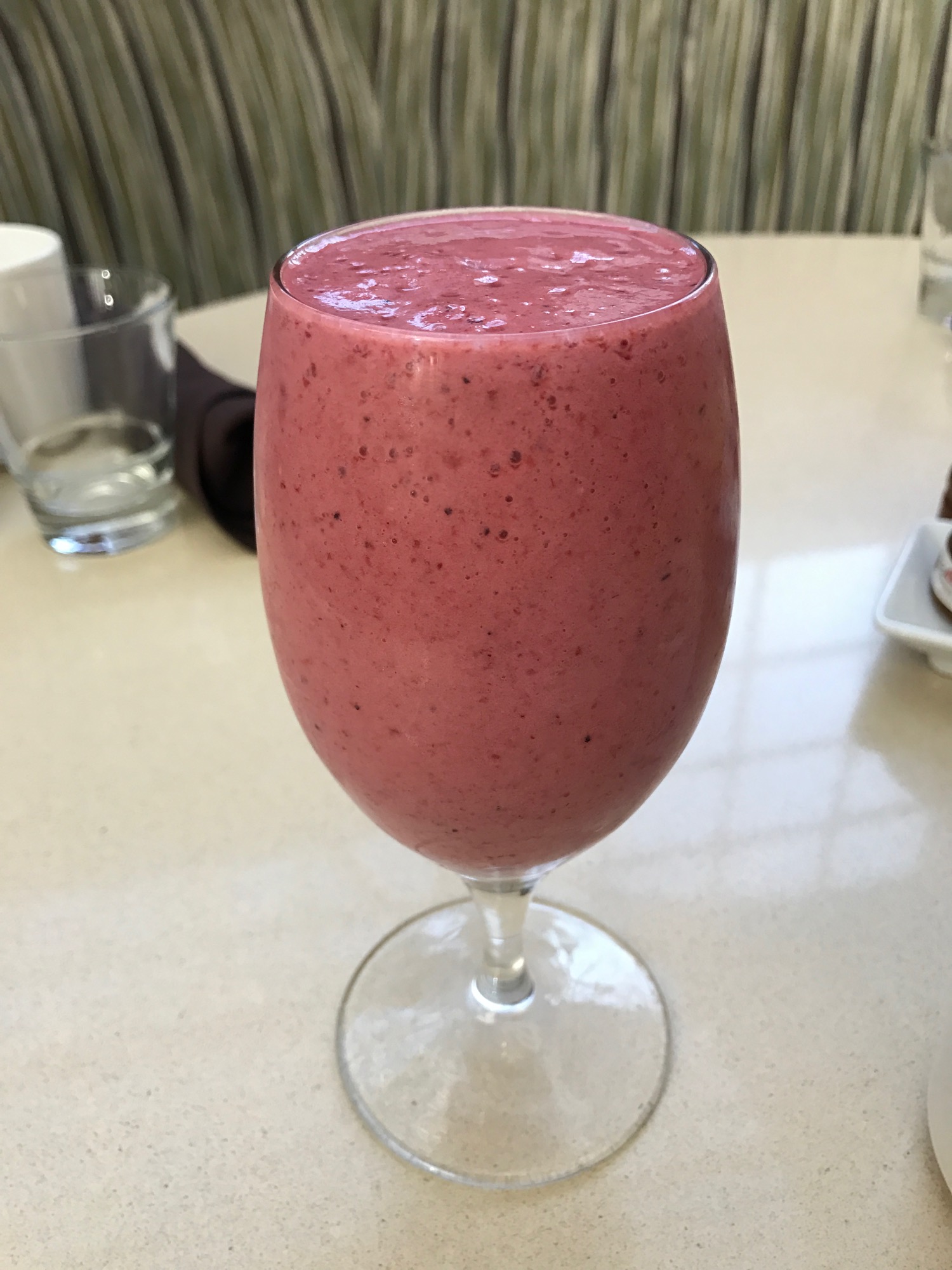 a glass of pink smoothie