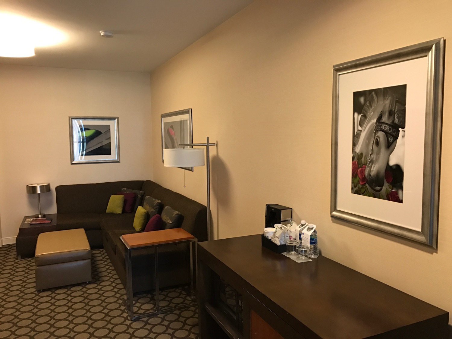a room with a couch and a picture on the wall