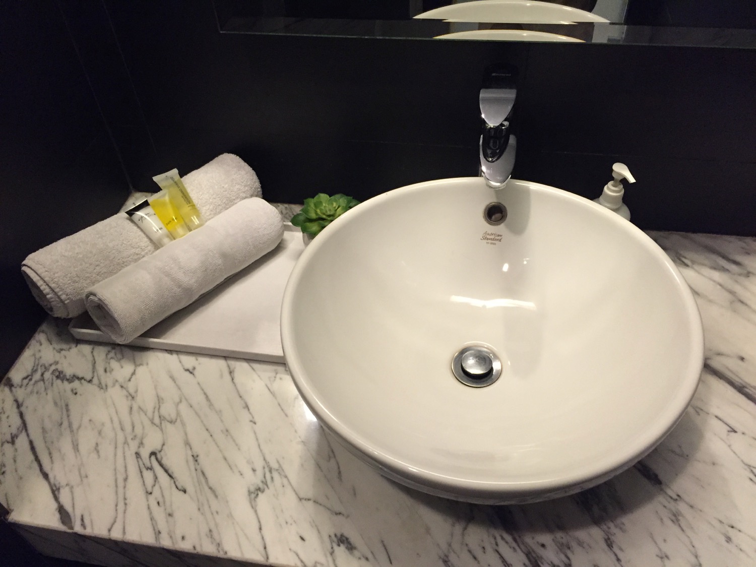 a sink and towel on a counter