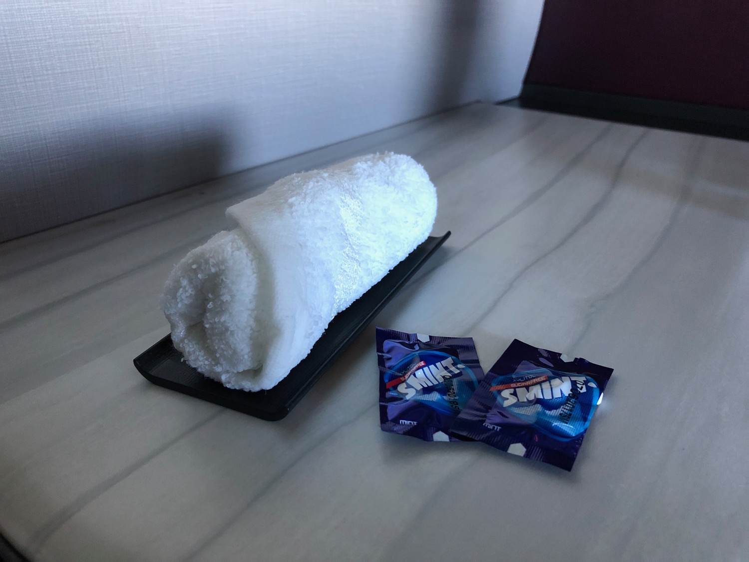 a towel roll and two packages of candy