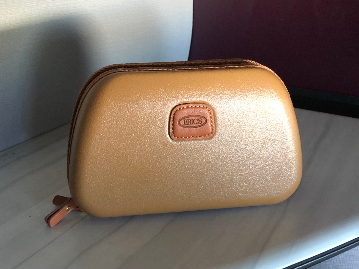 a small brown and tan bag
