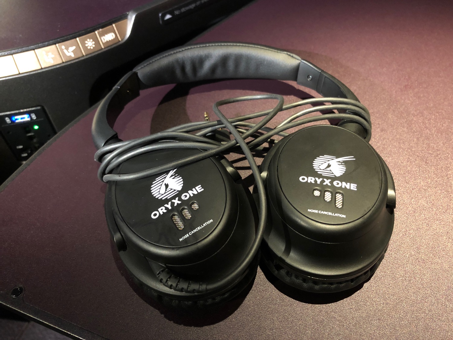 a pair of black headphones with wires