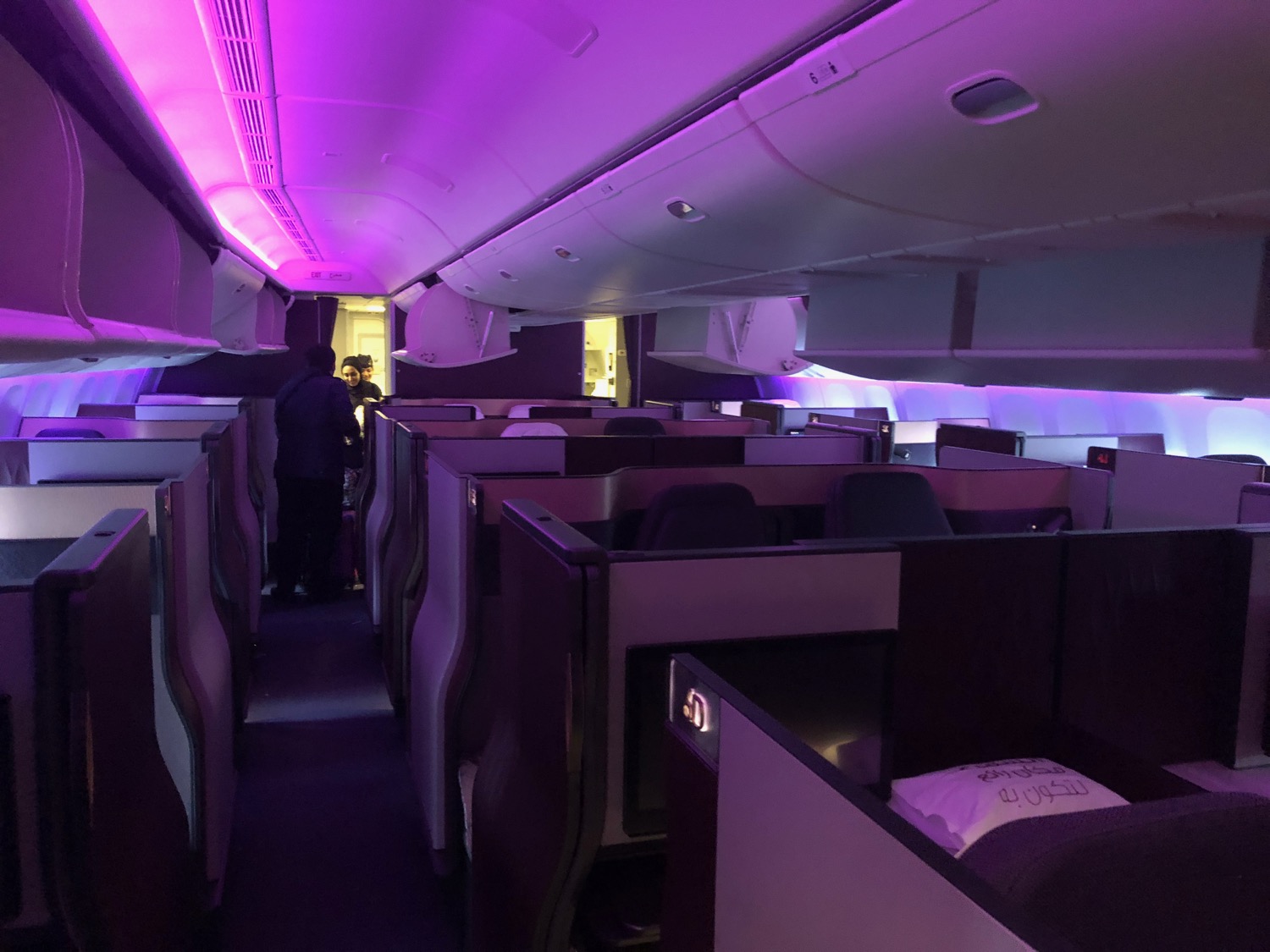 a inside of an airplane with purple lights