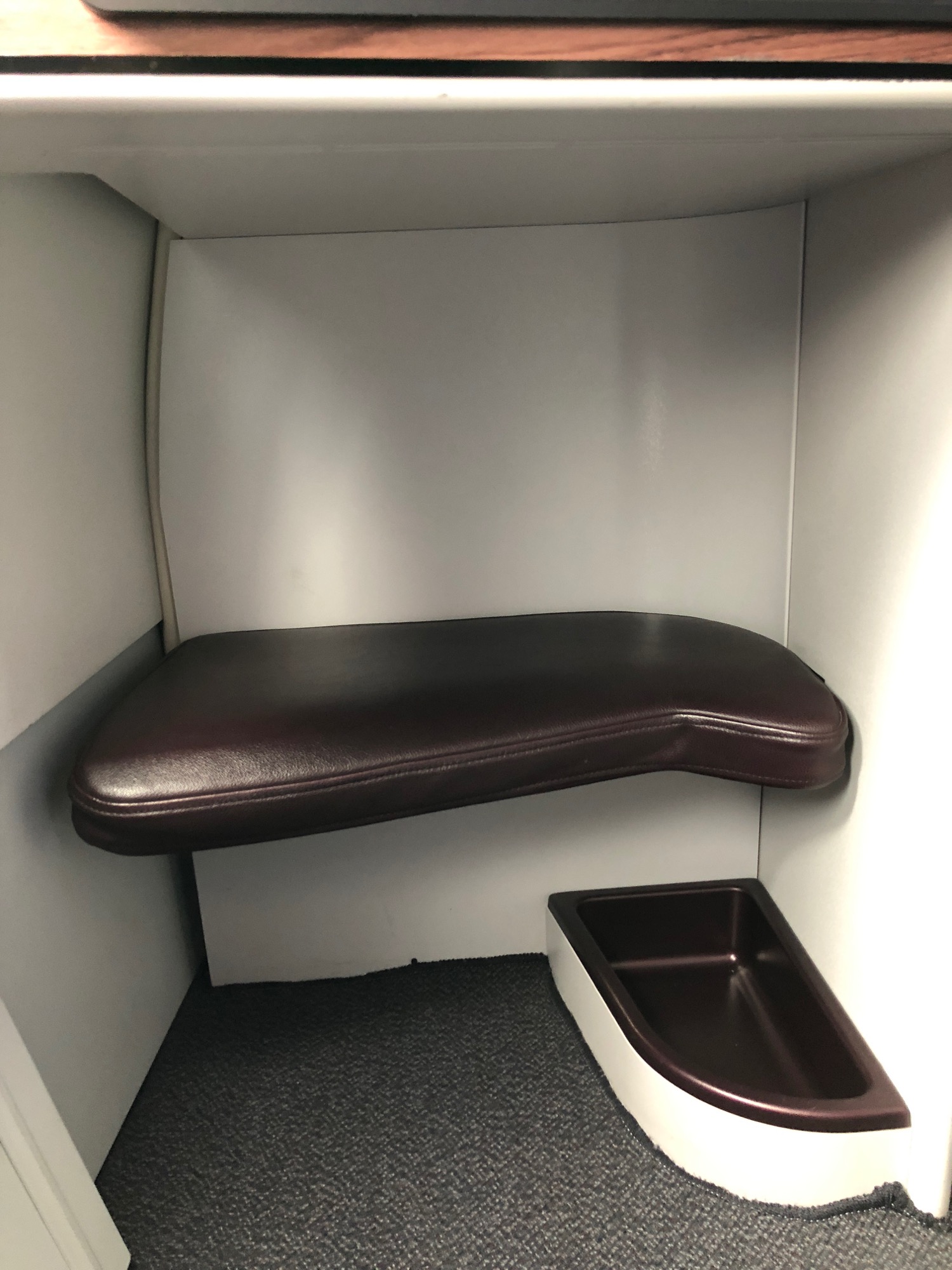 a seat in a small room