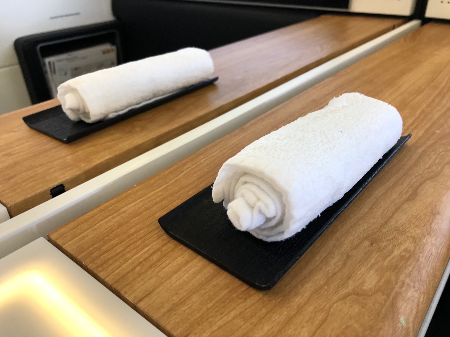 a pair of white towels on a table