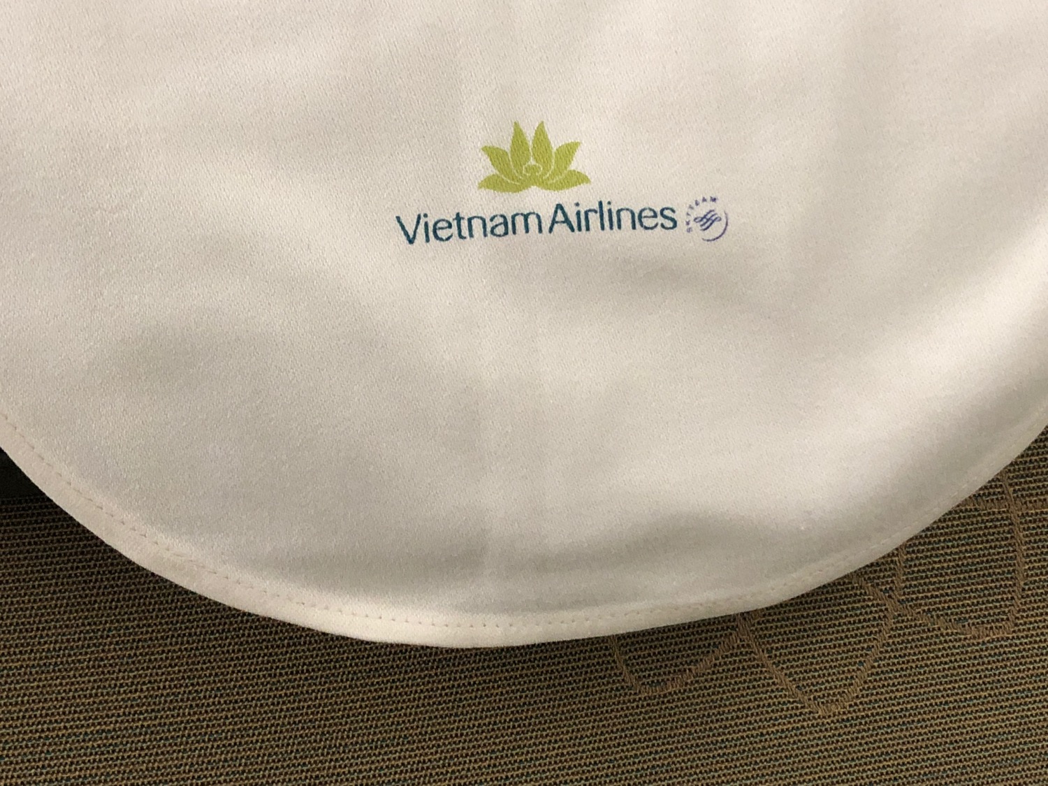 a white cloth with a logo on it
