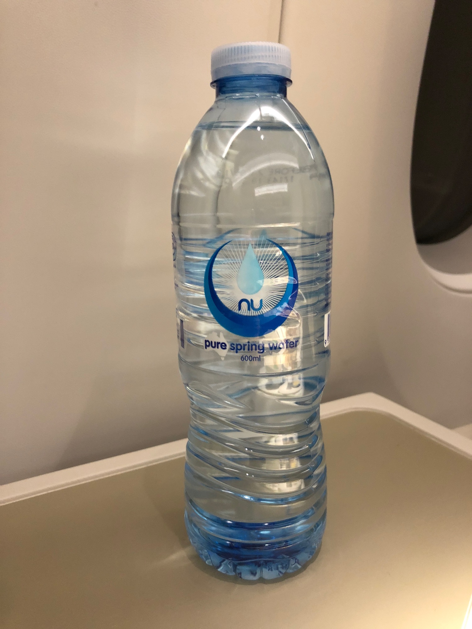 a bottle of water on a tray