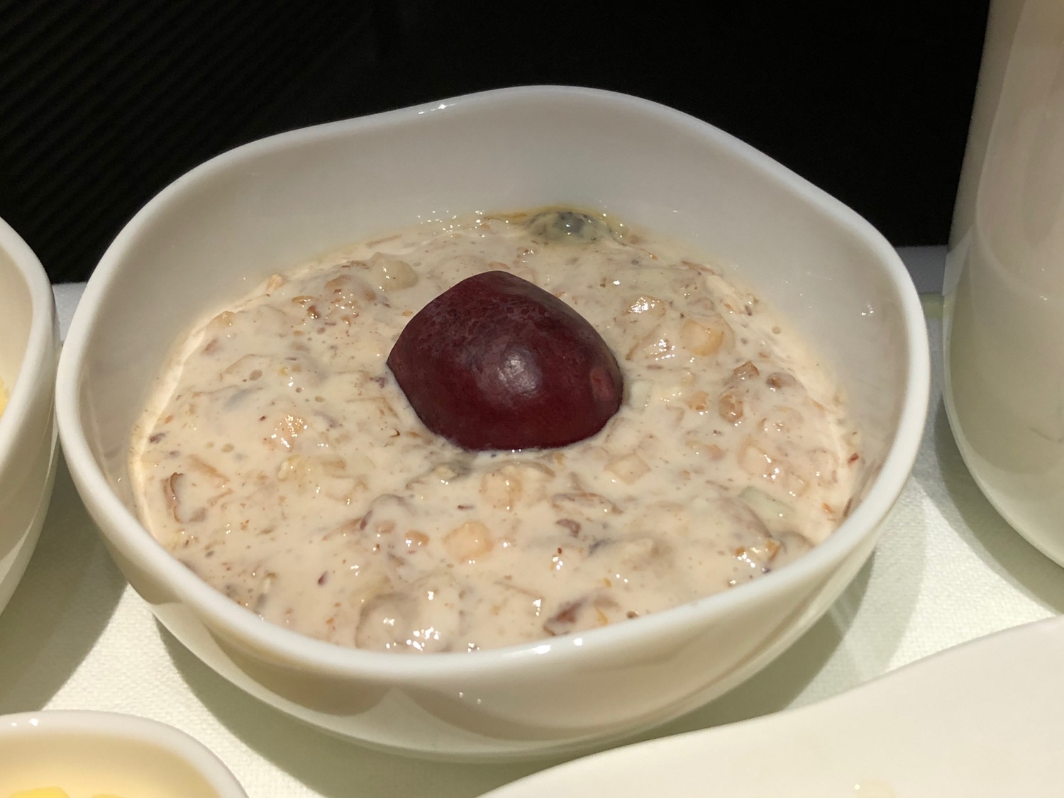 a bowl of oatmeal with a fruit in it