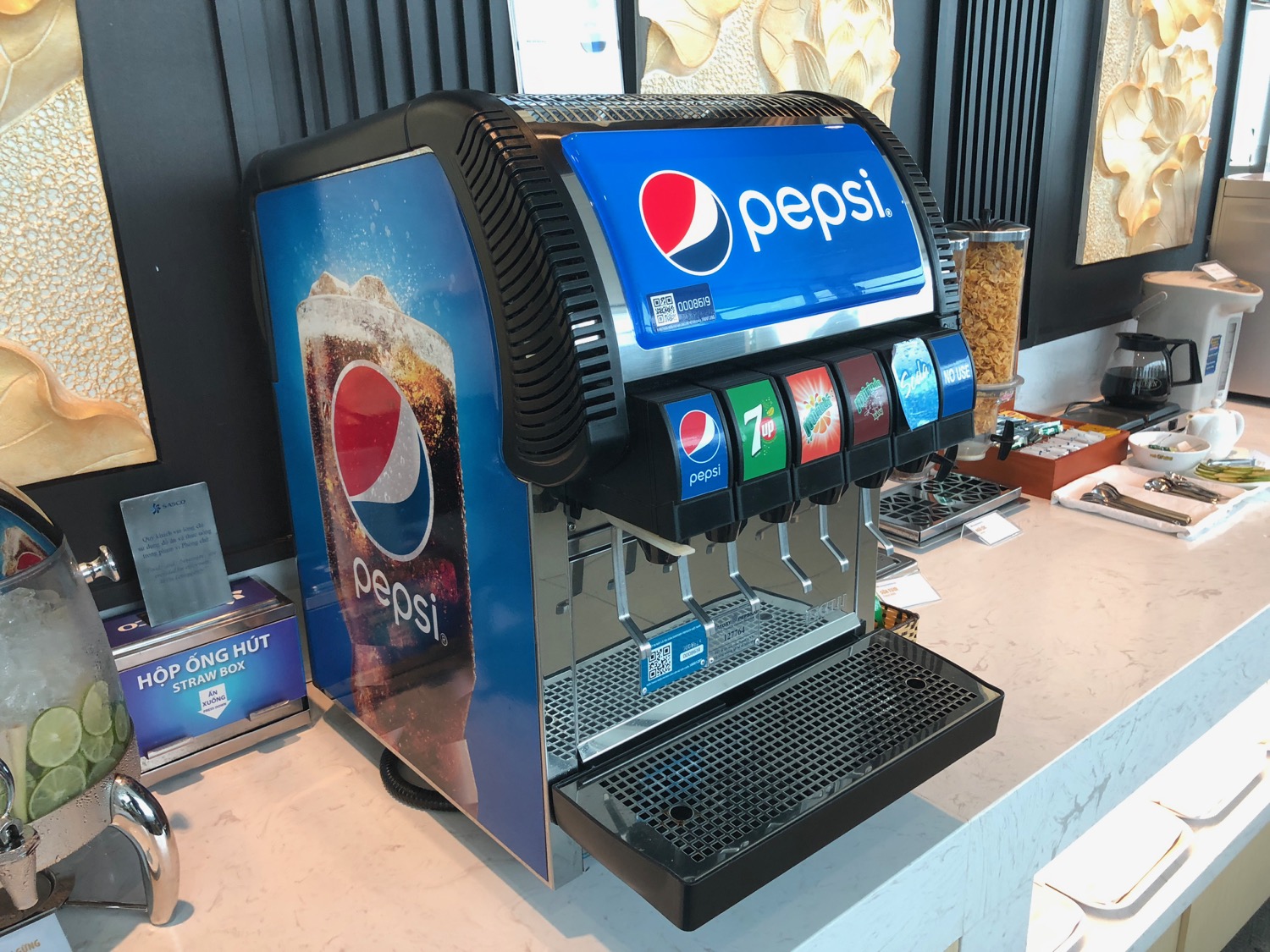 a soda dispenser on a counter