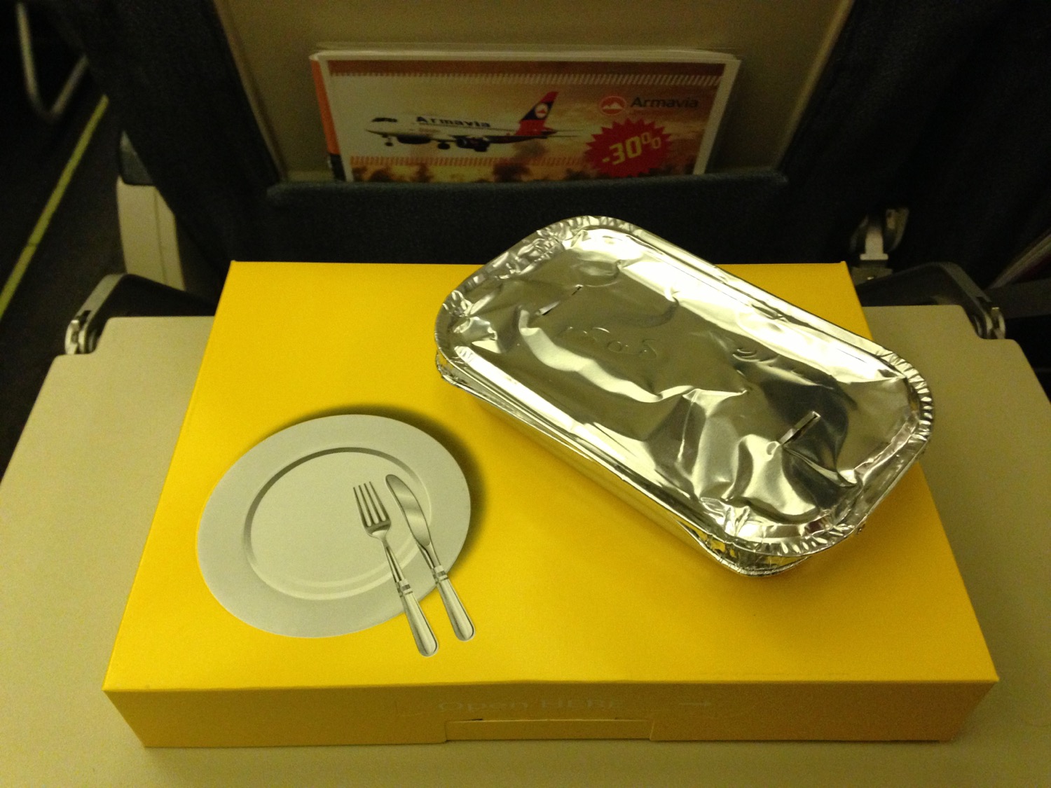 a tray and fork on a yellow box