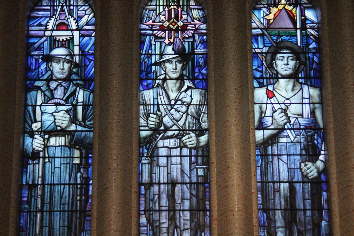 a stained glass window with a group of men
