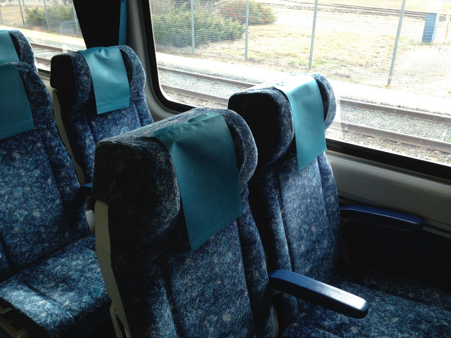 a blue seats with blue cloth on them