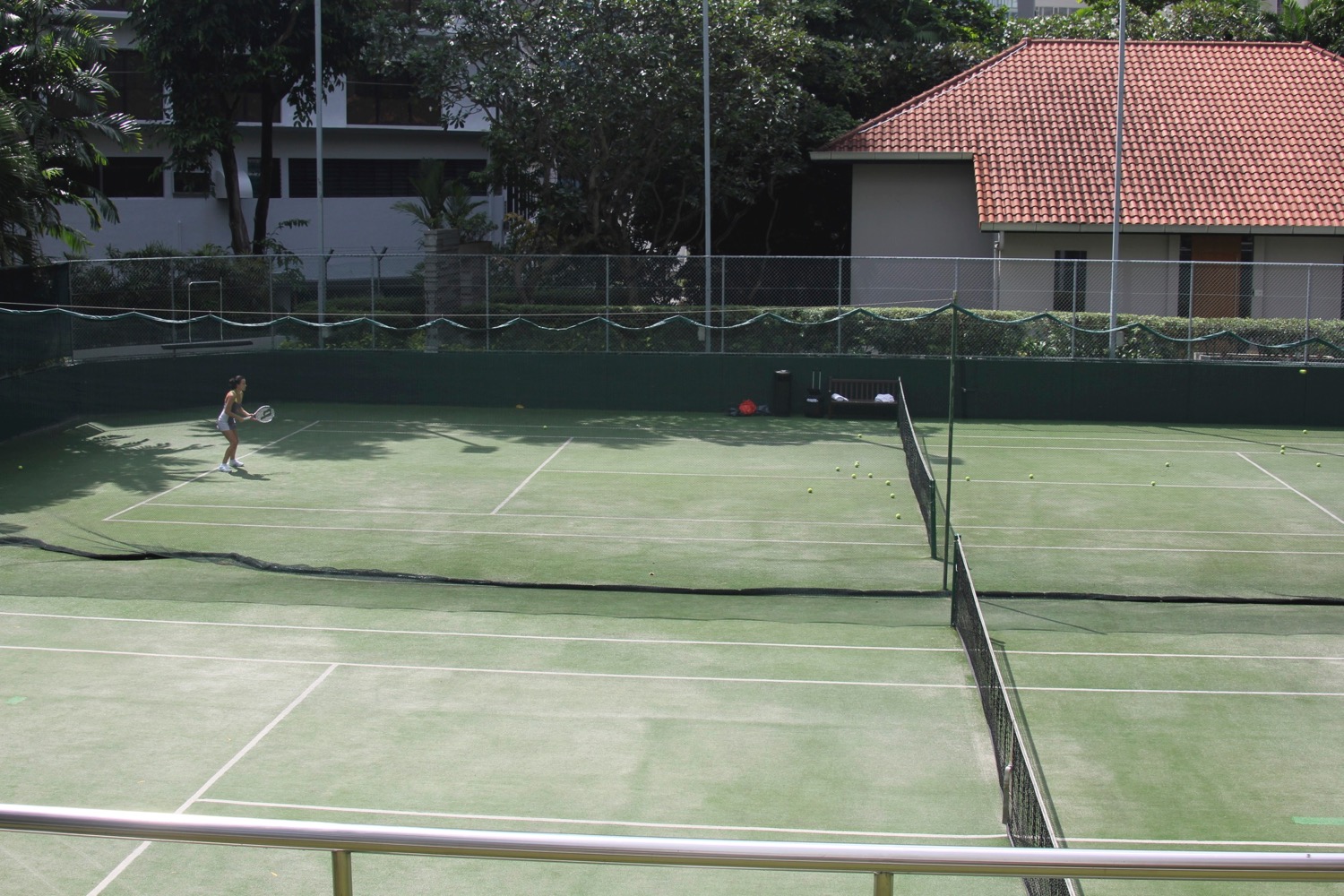 a woman playing tennis on a court