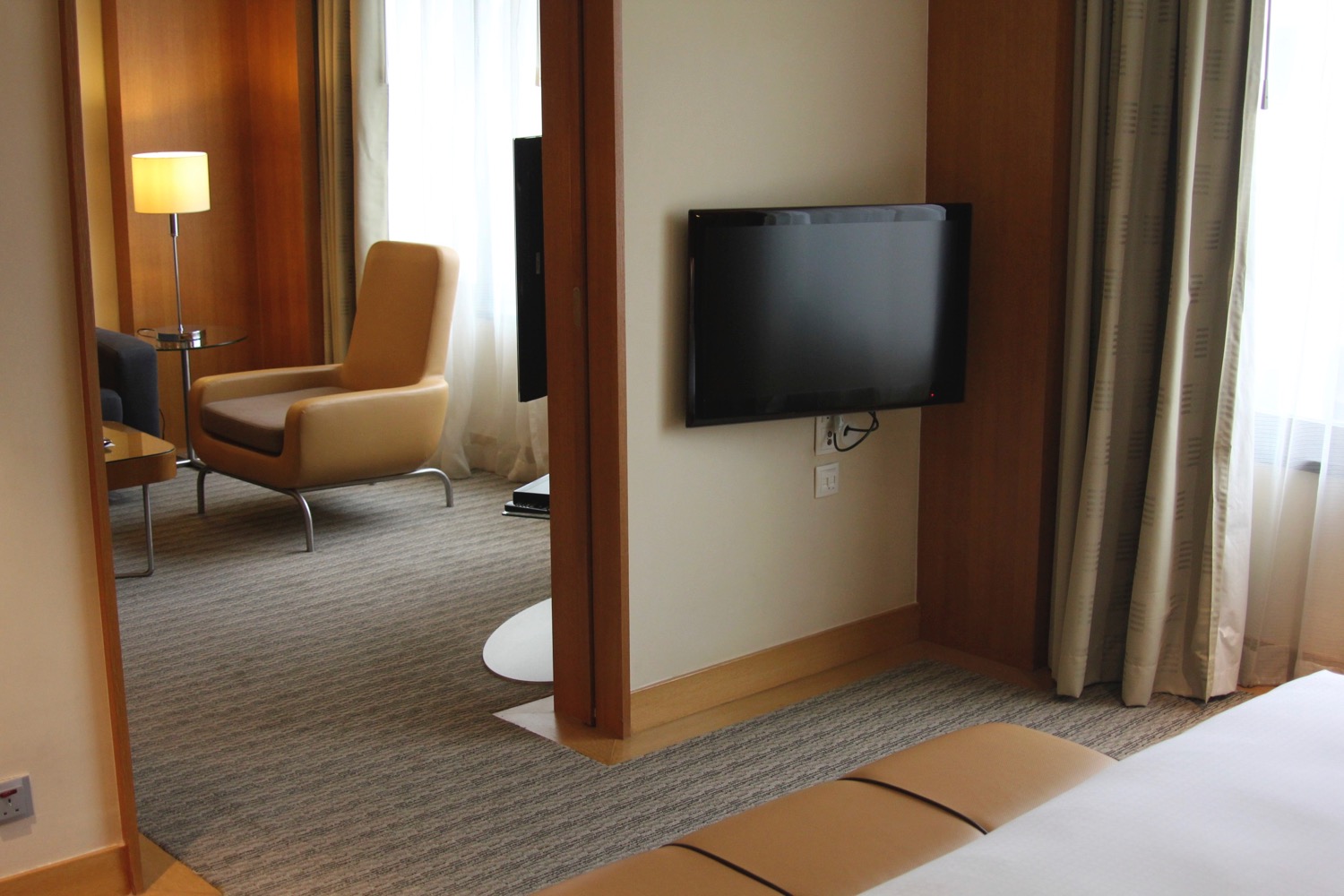 a tv on the wall in a hotel room