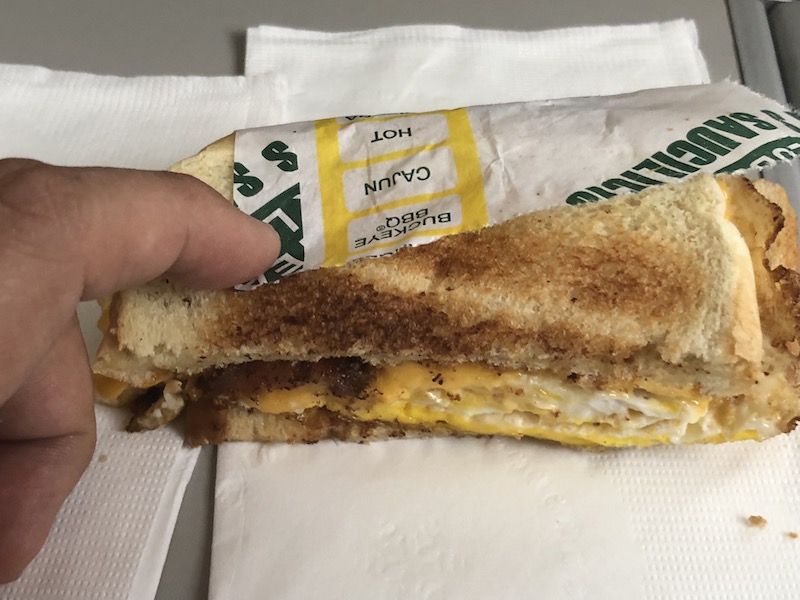 For those curious, egg, American cheese, one-bite of bacon (the other guy got the better cut) and white toast.