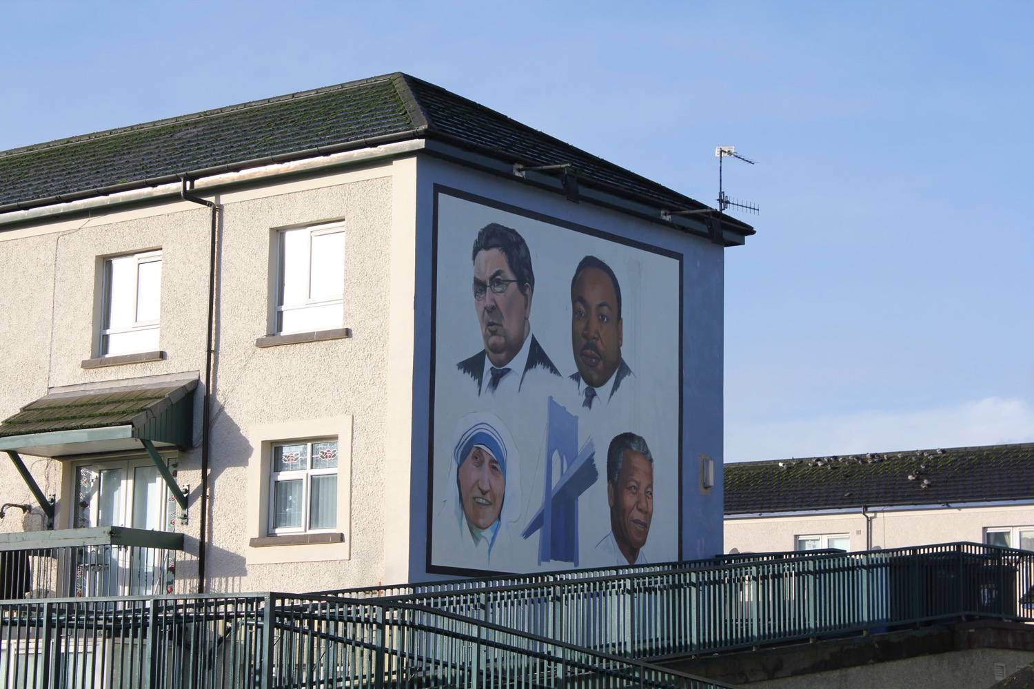 a building with a mural of men on it