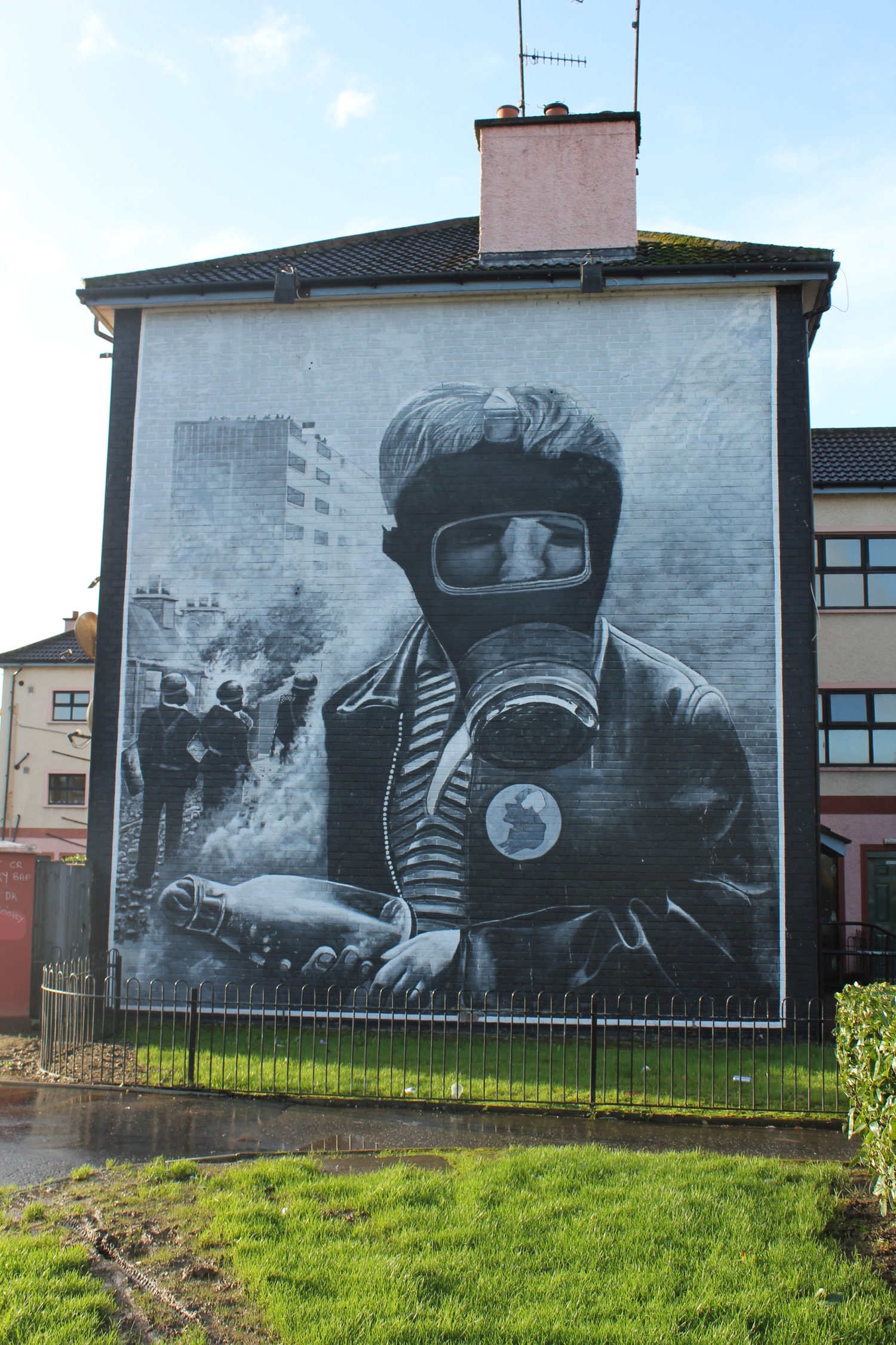 a mural of a person in a gas mask on a building