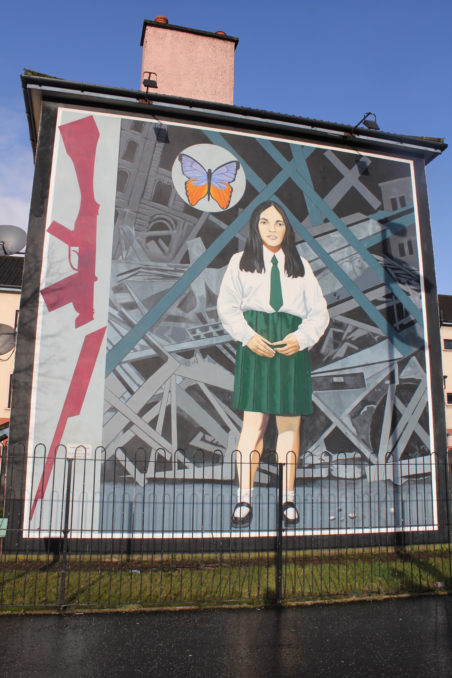 a mural of a woman and a butterfly