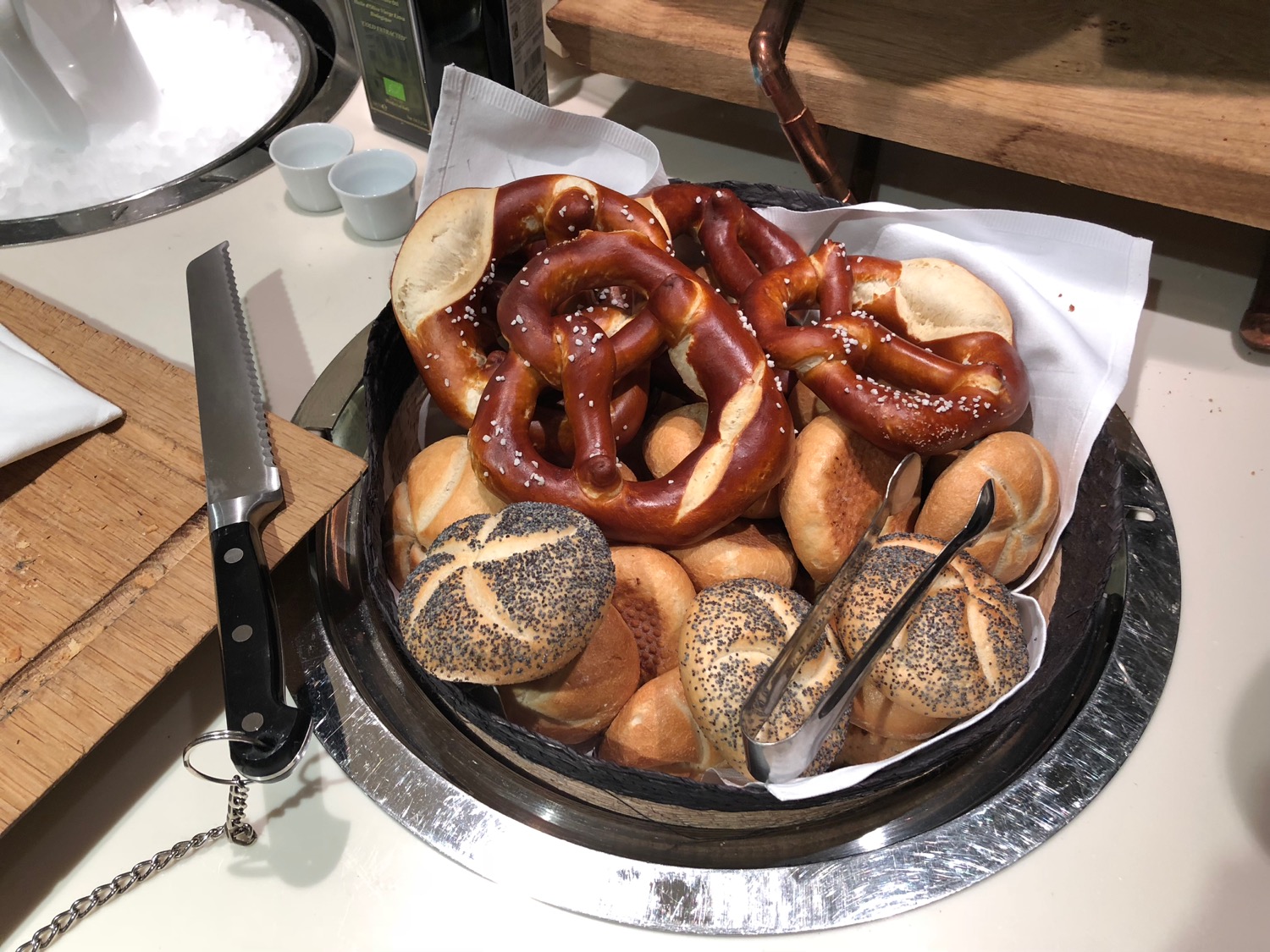 a basket of pretzels and rolls