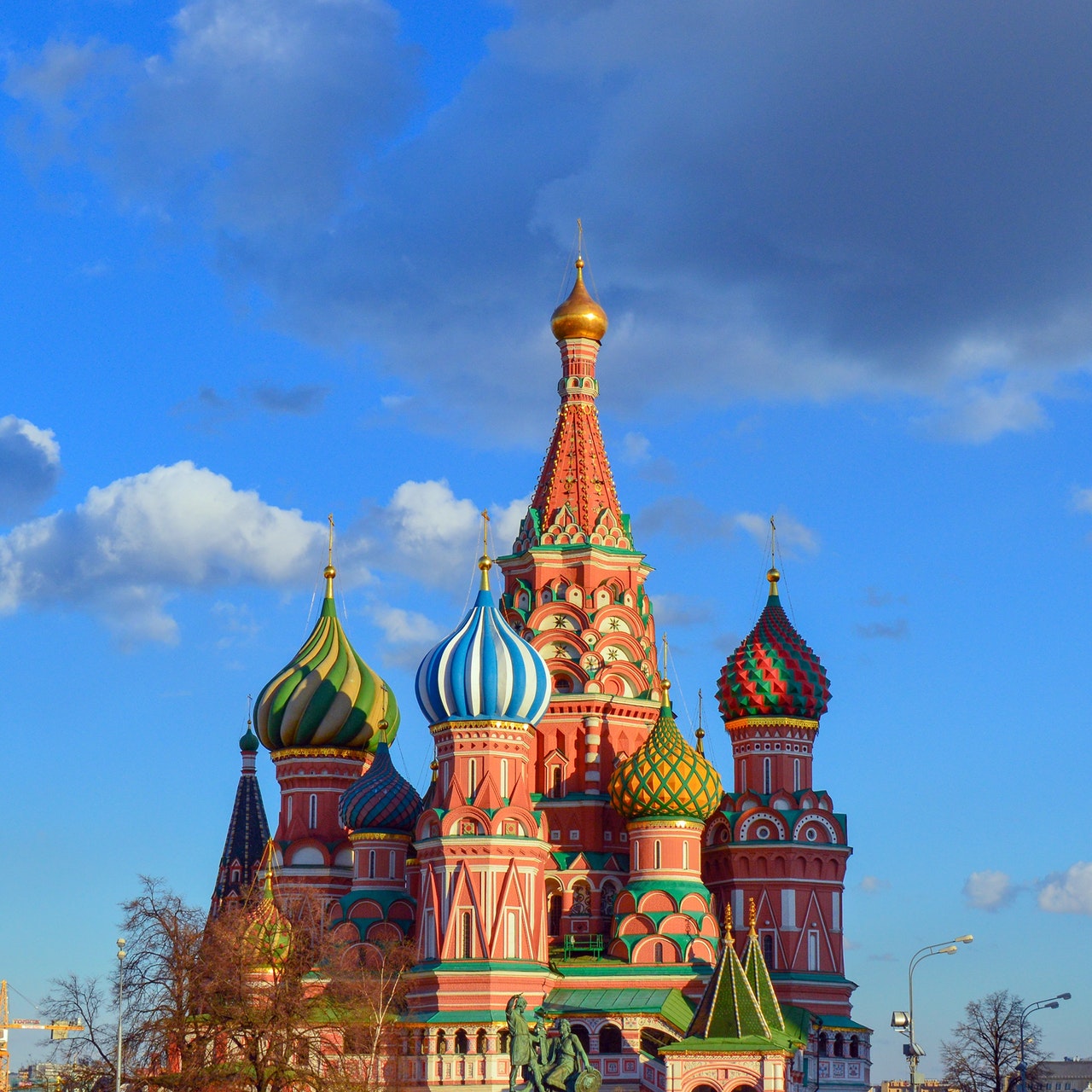 a colorful building with many domes with Saint Basil's Cathedral in the background