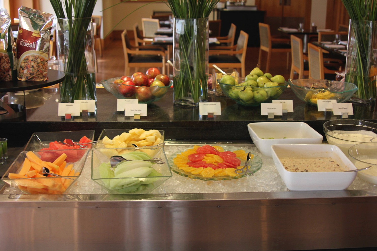 a buffet with different fruits on it