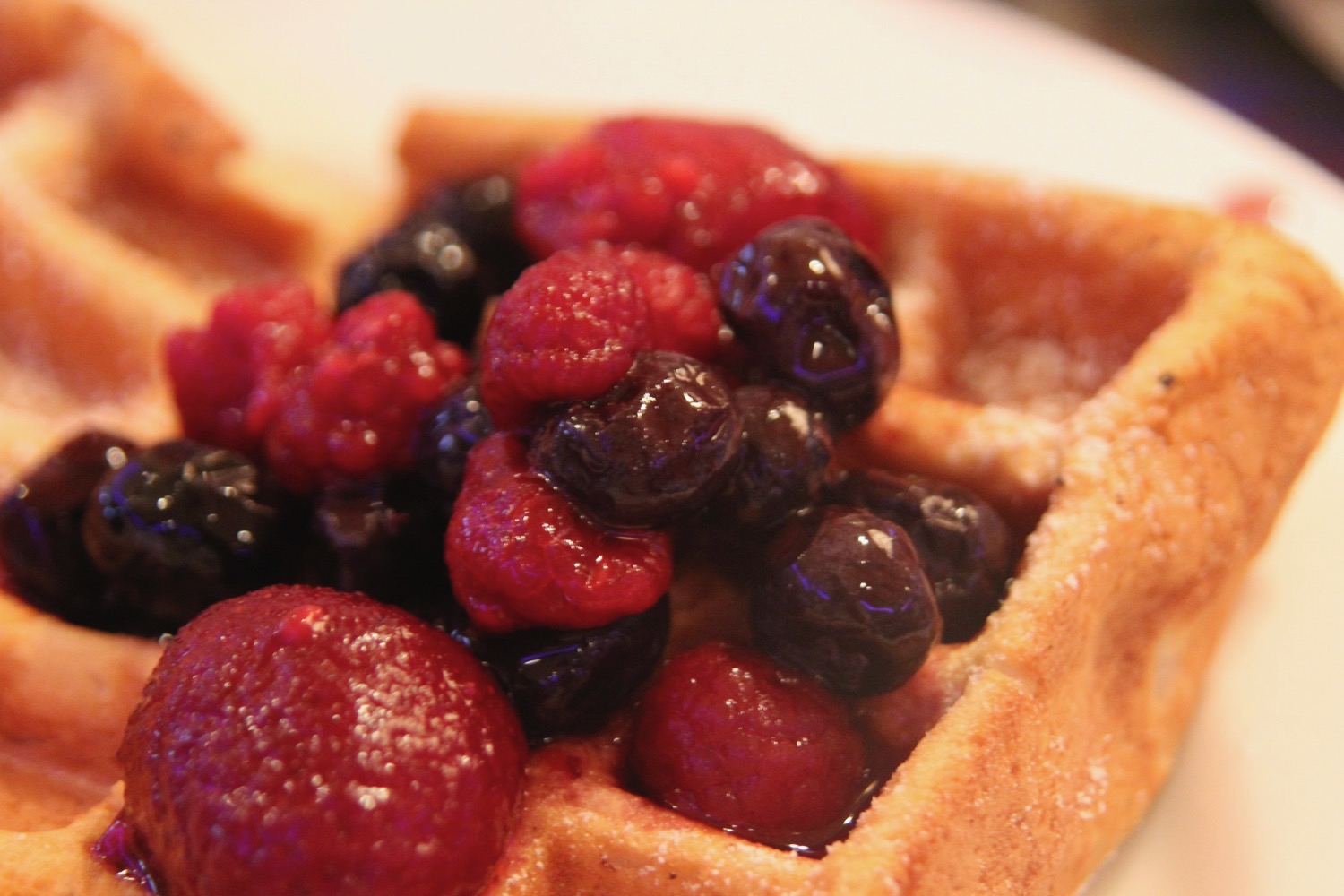 a waffle with berries on it