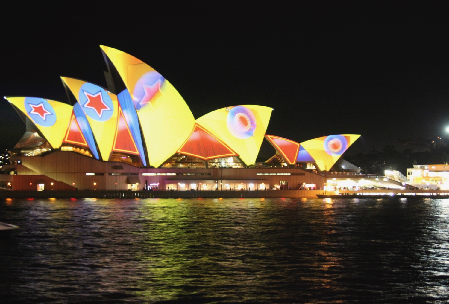 Sydney Opera House with colorful lights on top of it