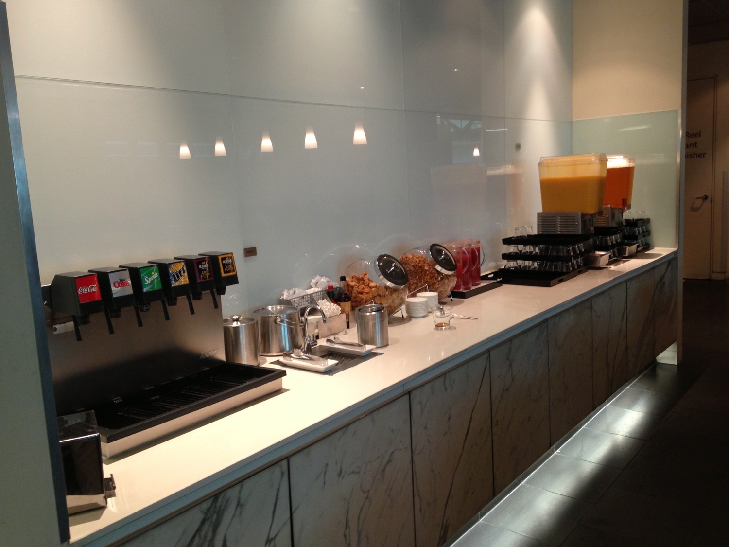 a counter with different drinks and beverages