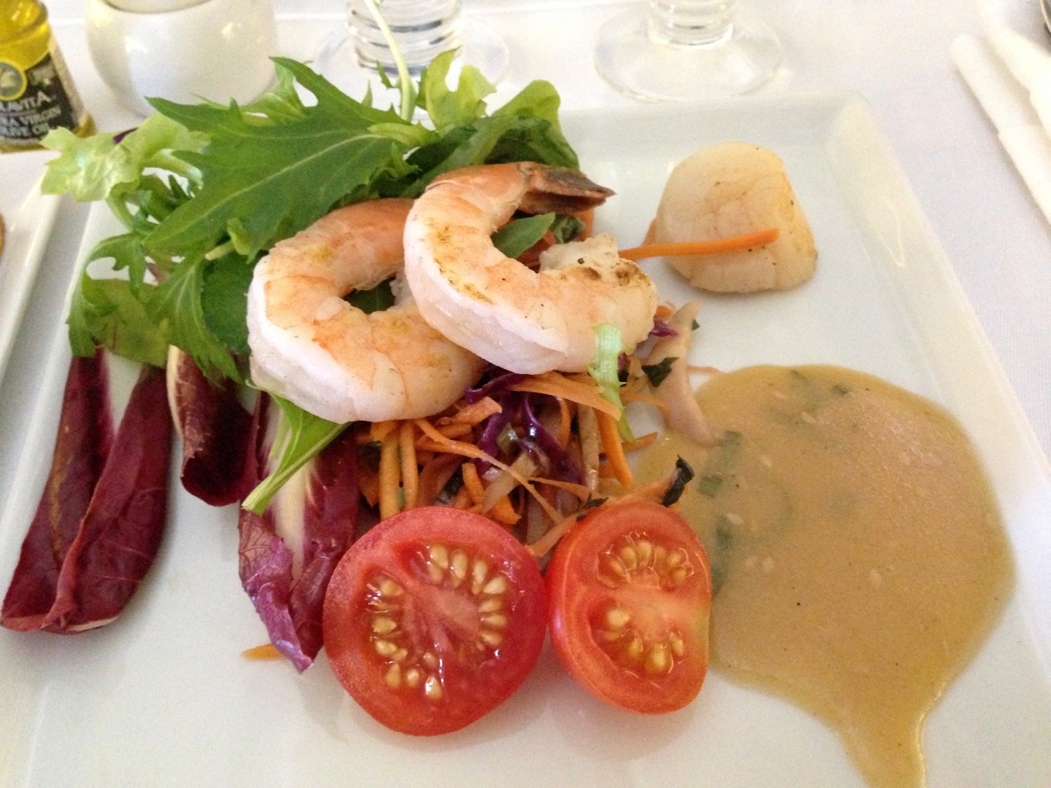 a plate of food with shrimp and vegetables
